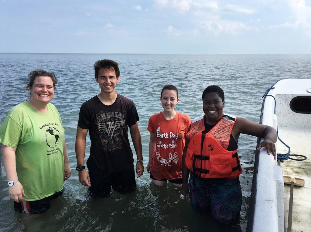 (From left) professor Sarah Sojka, Alex Kulvivat, Paige Edwards, and Jdody Misidor in the water along the eastern shore of Virginia.