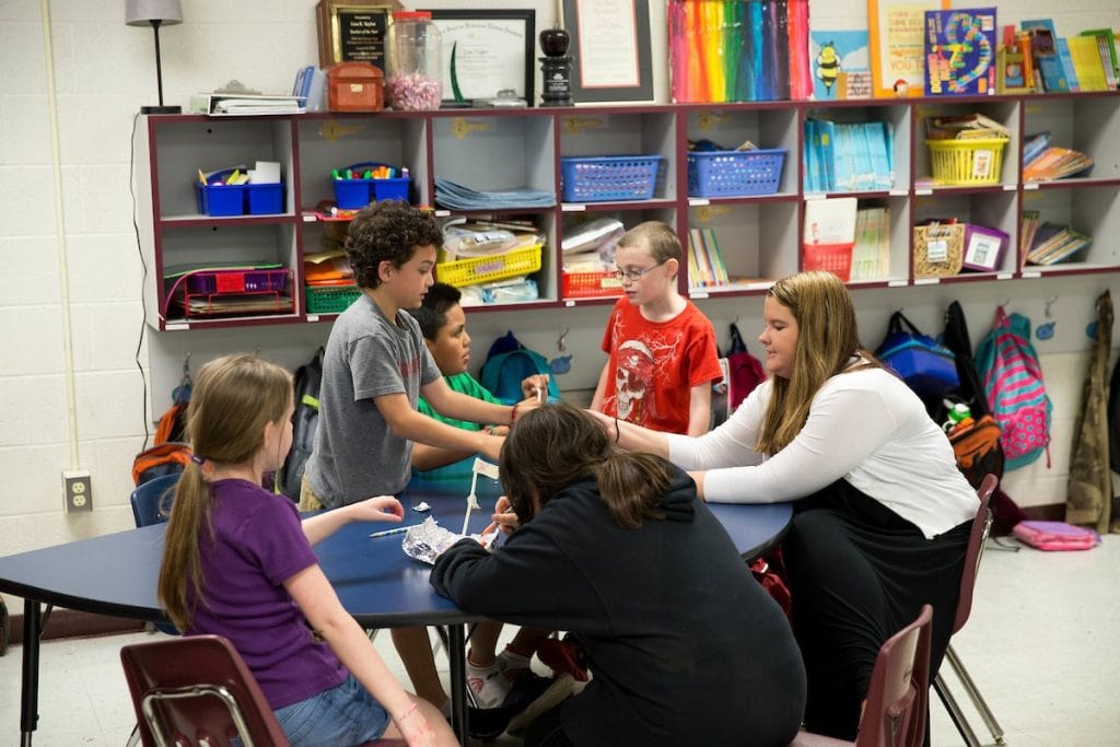 Randolph teaching alumna Kate Thornhill works with students in her elementary school classroom