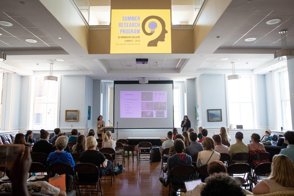 Keyu Jin and Priscilla Ranjitkar deliver their Summer Research presentation in Hampson Commons