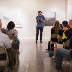 M.F.A. faculty member Kaveh Akbar shares his work during a public reading at the first residency last summer