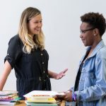 Professor Sara Beck converses with a student