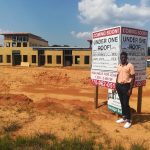 Niles Brown stands on the construction site for the new building he is helping design for Gateway Dental Exchange in Atlanta, Ga.