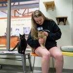 Hannah Overstreet pets cats at the Lynchburg Humane Society