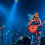 Psychology professor Sara Beck performs on stage