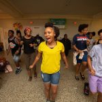 Students participate in a Harambee chant