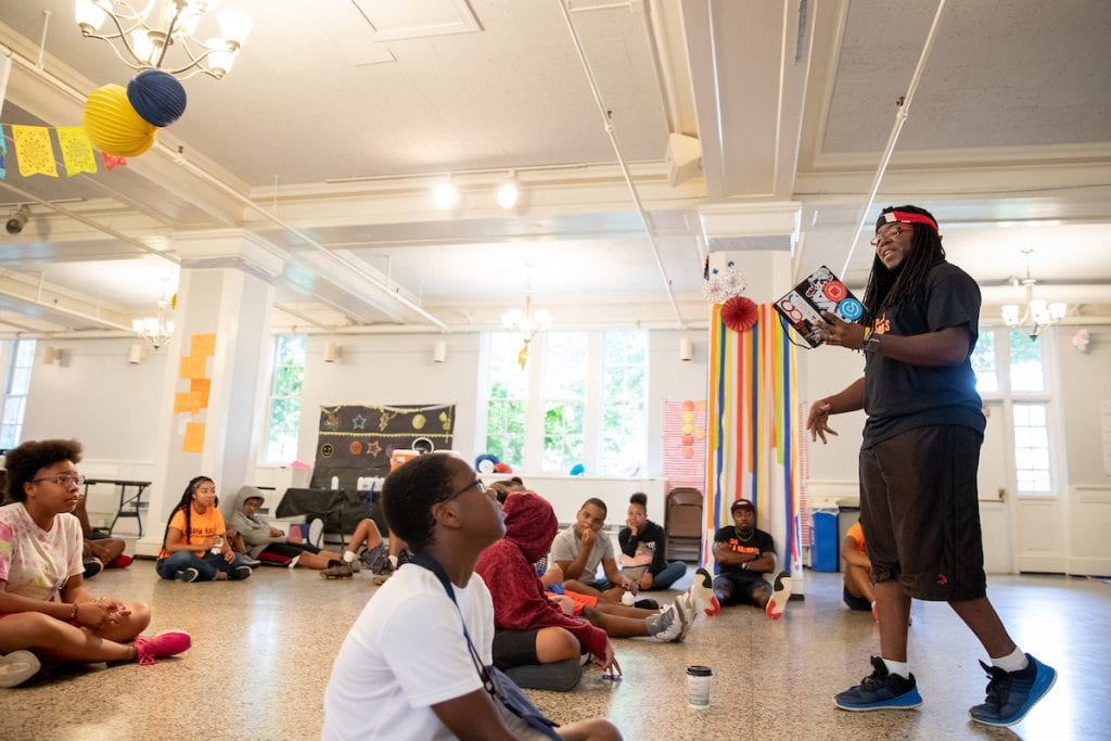 Nick George, founder and executive director of The Listening, Inc., reads from his poetry at the Freedom School.