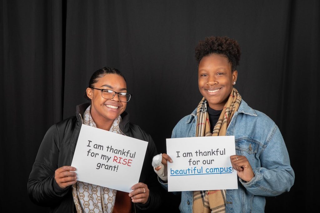 Students pose in the Giving Tuesday photo booth during the day of giving in 2018