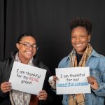 Students pose in the Giving Tuesday photo booth during the day of giving in 2018