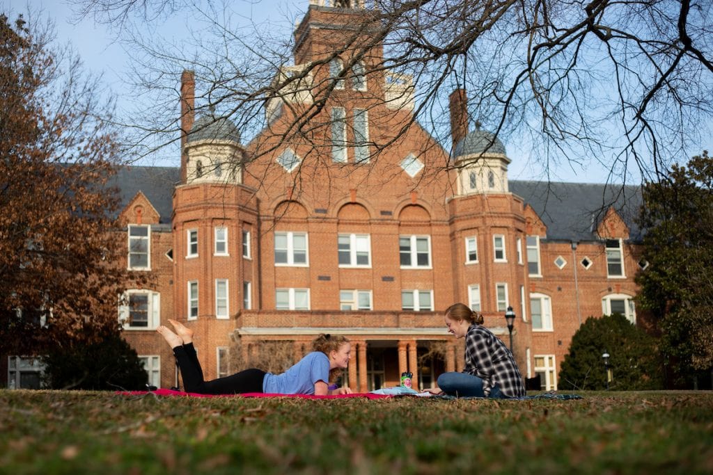 Students study in front of Main Hall