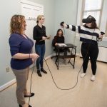 Students and faculty test out the equipment in the new virtual reality testing room