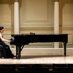 Emily Yap Chua warms up on piano prior to the recital