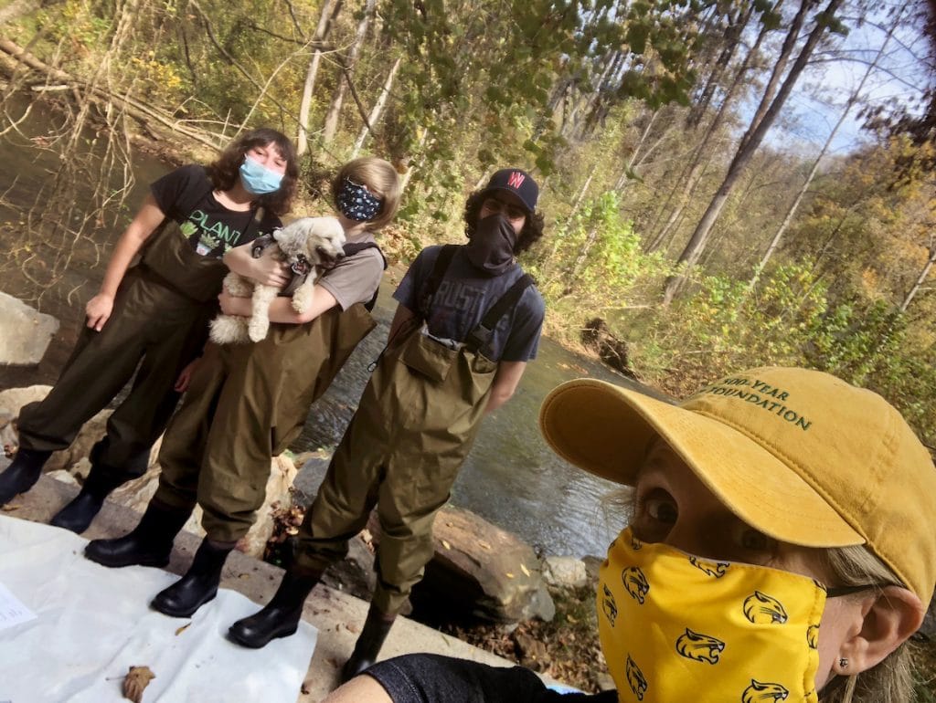 Karin Warren, right, takes a photo with Sarah Greene '24, Hailey Gilman '22, and Alex Long '22 during their work at Blackwater Creek.