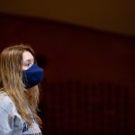 Kayla Morris' 22 uses a specially designed mask to sing during a class.