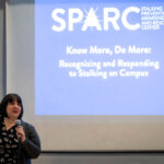 Dana Fleitman, associate advisor for the Stalking Prevention, Awareness and Resource Center, speaks to Randolph faculty and staff during the on-campus training session.