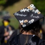A photo from a past Randolph Commencement, focusing on a graduate's cap, which reads A photo from a past Randolph Commencement, focusing on a graduate's cap, which reads