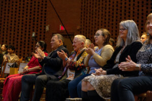 Sri Lankan Ambassador Mahinda Samarasinghe and President Sue Ott Rowlands sit in the audience in Houston Memorial Chapel during a performance