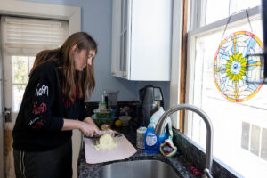 Katelyn Moir cuts up an onion