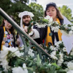 A group of seniors from the Class of 2025 place the Daisy Chain around the Sundial A group of seniors from the Class of 2025 place the Daisy Chain around the Sundial