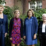 Stacey Robbins Kennedy ’95, Lesley Morgan ’75, and Alison Keller Townsend ’75 pose with President Sue Ott Rowlands after receiving the Alumni Achievement Award