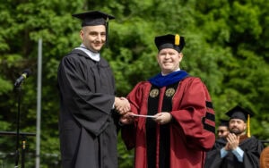 Jacob Lofaso receives the Maude Huff Fife Award from Provost Tim Smith