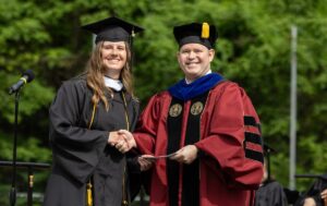 Paige Scruggs receives the Maude Huff Fife Award from Provost Tim Smith