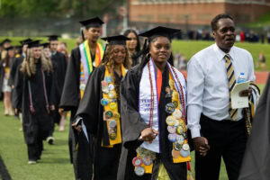 Students walk in the processional during Commencement 