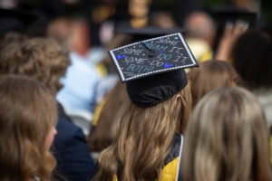 A close-up of a cap in the Commencement crowd 