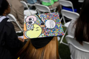 A close-up of a decorated cap during Commencement 