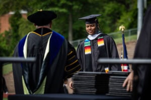 A student receives his disploma onstage