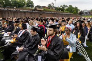 A crowd shot, everyone clapping, from Commencement