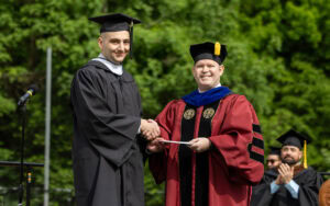 Jacob Lofaso receives the Maude Huff Fife Award from Provost Tim Smith