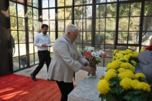 President Sue Ott Rowlands places flowers down during a visit tothe Sri Lankan embassy in DC