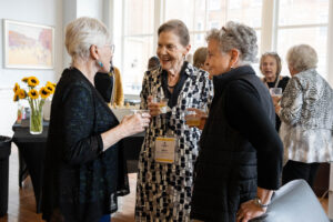 A group of alums talk during a Reunion event