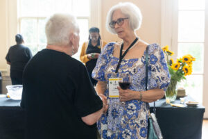 President Sue Ott Rowlands talks with an alum during Reunion