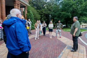 Professor Gerry Sherayko leads a walking tour on campus during Reunion