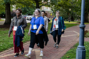 A group of alums walks on front campus during Reunion