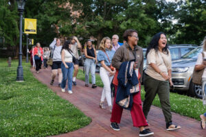A group of alums walks on front campus during Reunion