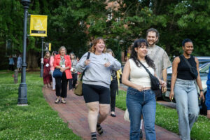 A group of alums walks on front campus during Reunion