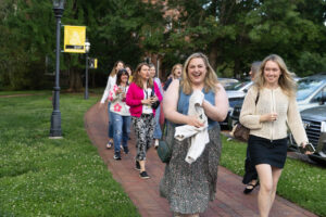 A group of alums walks on front campus during Reunion