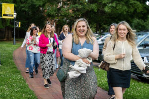 A group of alums walks on front campus during Reunion