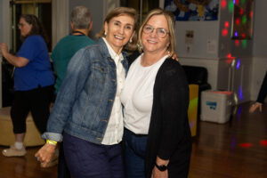 Two alums pose for a photo together during Reunion