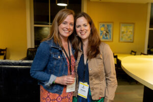 Two alums pose for a photo together during Reunion