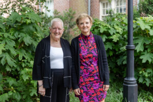 Lesley Morgan ’75 poses for a photo with Sue Ott Rowlands after receiving the 2025 Alumni Achievement Award 