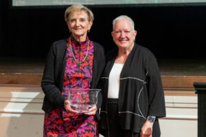 Lesley Morgan ’75 poses for a photo with Sue Ott Rowlands after receiving the 2025 Alumni Achievement Award 