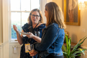 Alums talk during a Reunion event at Randolph House