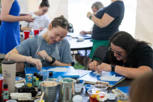 Alums participate in a Paint and Sip event during Reunion