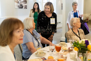 A group of women talking at a table.