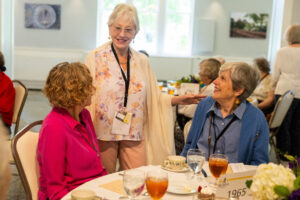 A group of women talking at a table.
