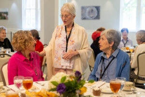 A group of women talking at a table.