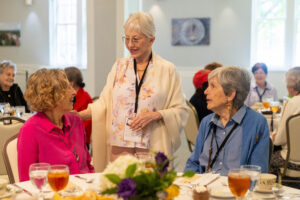A group of women talking at a table.